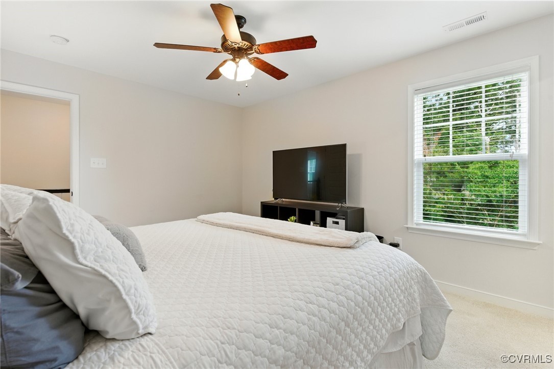 2201 Vandover Road Henrico, VA 23229 - Photo 17 of 43 a bedroom with a large bed and a flat tv screen