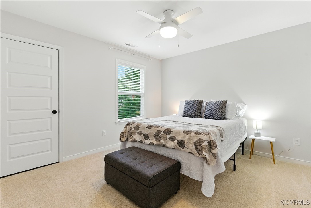 2201 Vandover Road Henrico, VA 23229 - Photo 18 of 43 a bedroom with a bed couch and a window