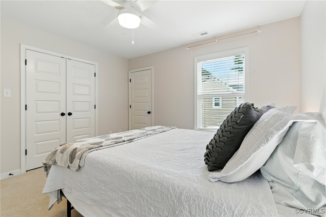 2201 Vandover Road Henrico, VA 23229 - Photo 19 of 43 a bedroom with a bed and a chandelier