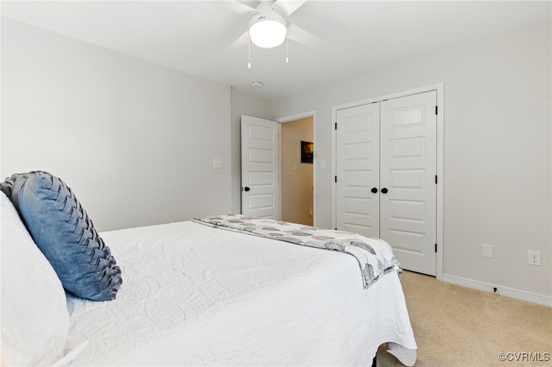 2201 Vandover Road Henrico, VA 23229 - Photo 20 of 43 a bedroom with a bed and a chandelier