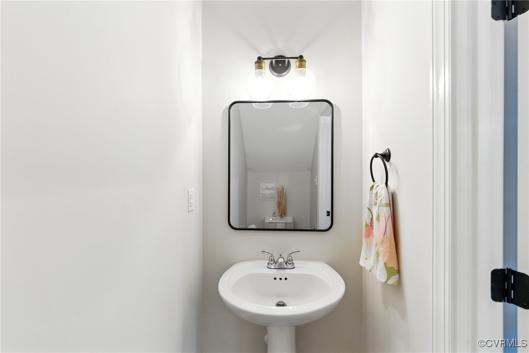 2201 Vandover Road Henrico, VA 23229 - Photo 23 of 43 a bathroom with a sink and a mirror