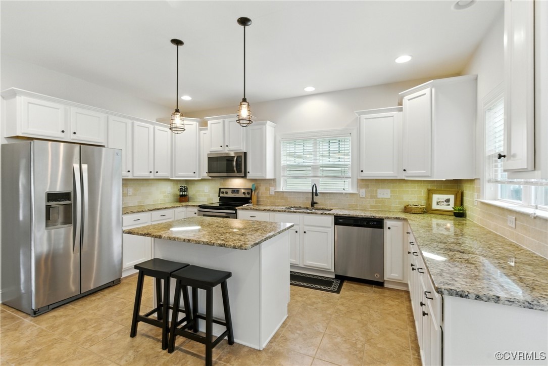 2201 Vandover Road Henrico, VA 23229 - Photo 8 of 43 a kitchen with stainless steel appliances granite countertop white cabinets granite counter tops and a view of living room