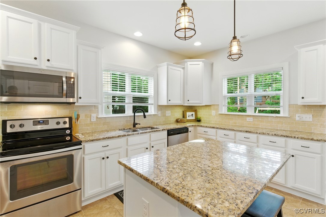 2201 Vandover Road Henrico, VA 23229 - Photo 9 of 43 a kitchen with stainless steel appliances granite countertop a stove sink microwave and window