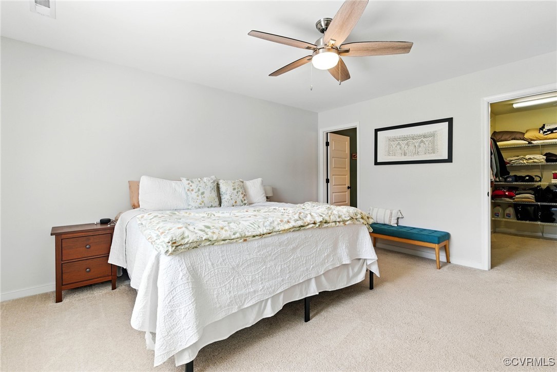 2201 Vandover Road Henrico, VA 23229 - Photo 10 of 43 a bedroom with a bed and a chandelier