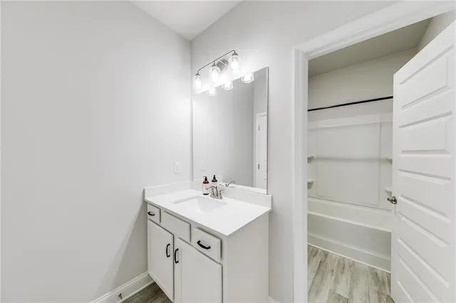 a bathroom with a bathtub and a toilet