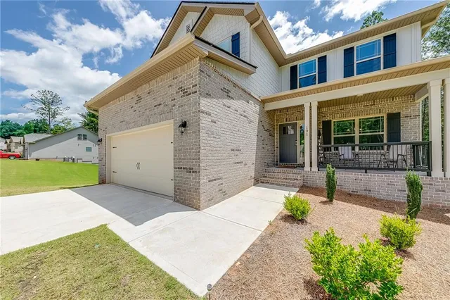 front view of a house with a yard
