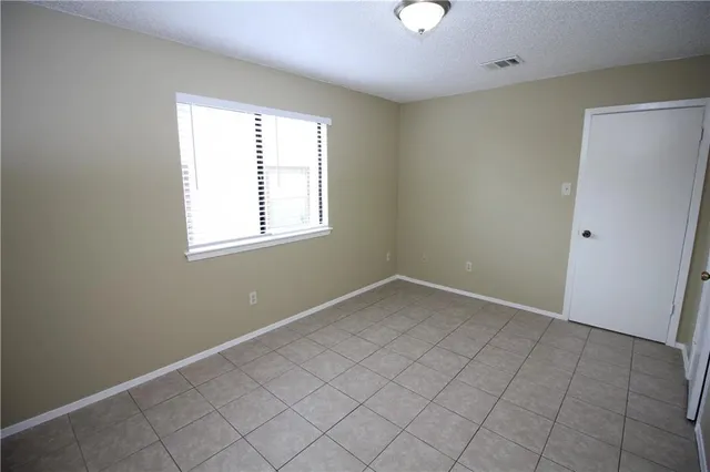 a view of a hallway with a chandelier fan