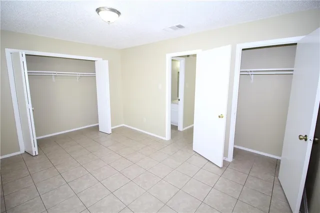 a bathroom with a toilet and a bathtub