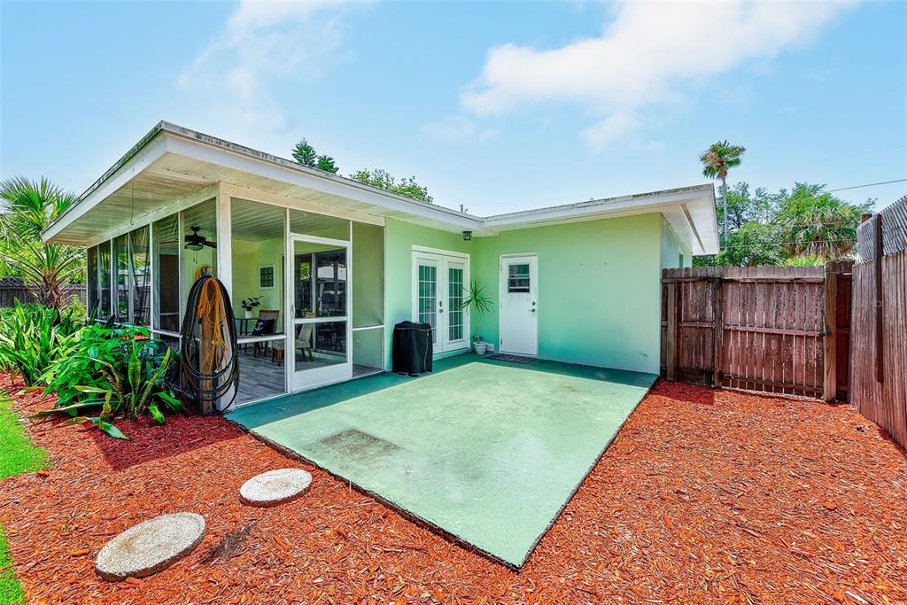 14079 Victoria Road Largo, FL 33774 - Photo 31 of 46 a view of an house with backyard and porch