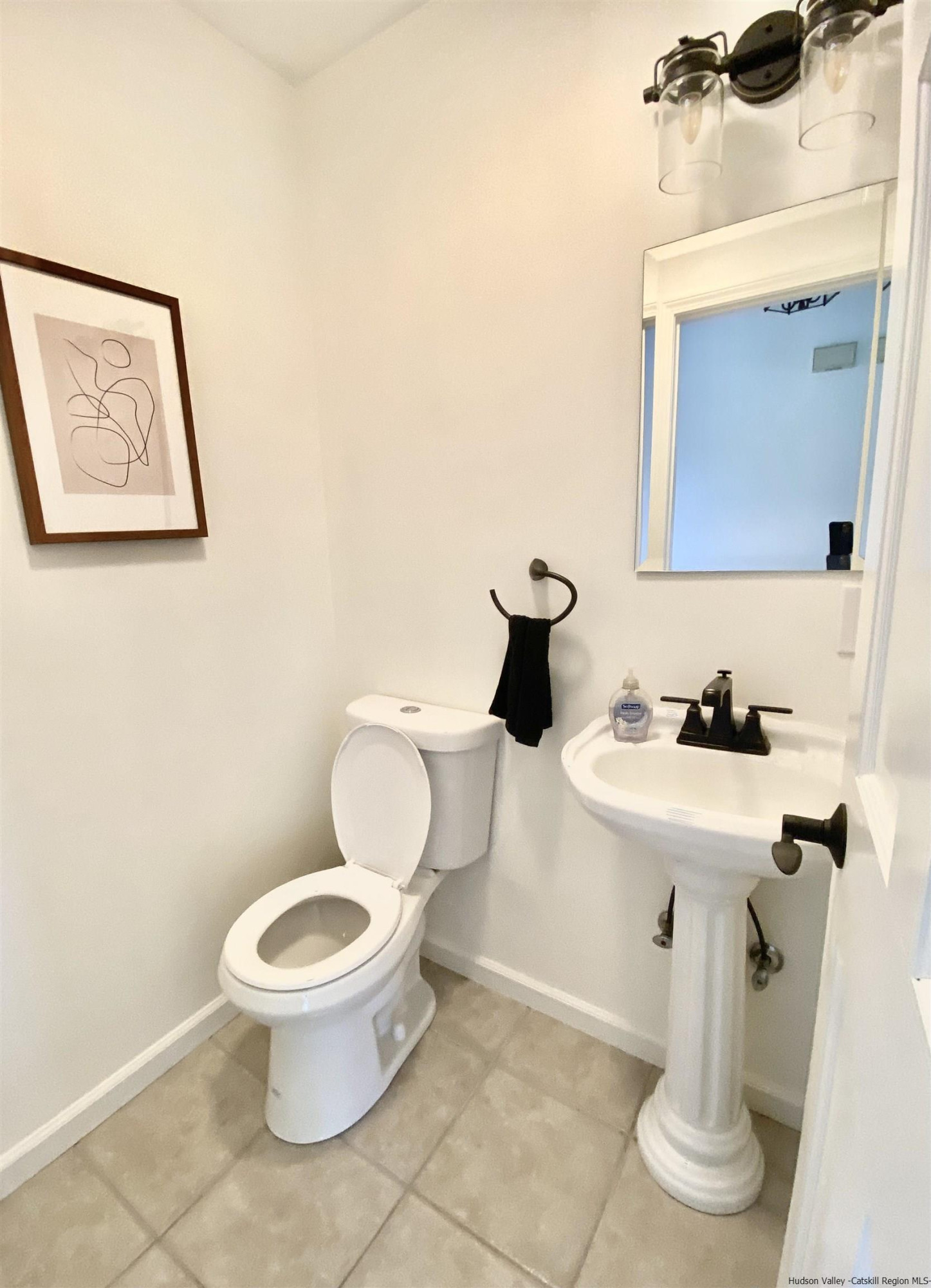 29 Millbrook Road Gardiner, NY 12589 - Photo 13 of 34 a bathroom with a toilet a sink and mirror