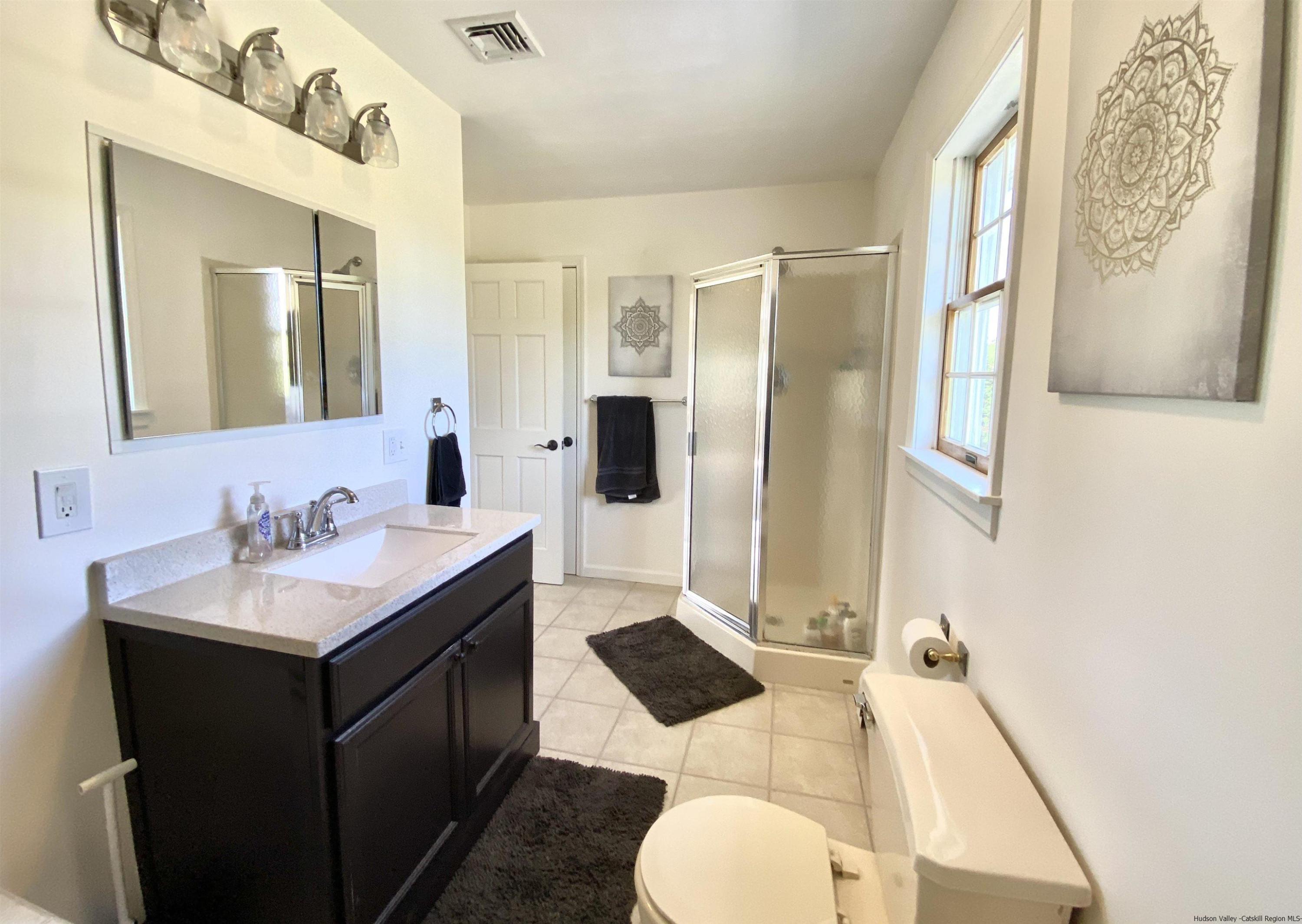 29 Millbrook Road Gardiner, NY 12589 - Photo 15 of 34 a bathroom with a sink vanity granite and a mirror