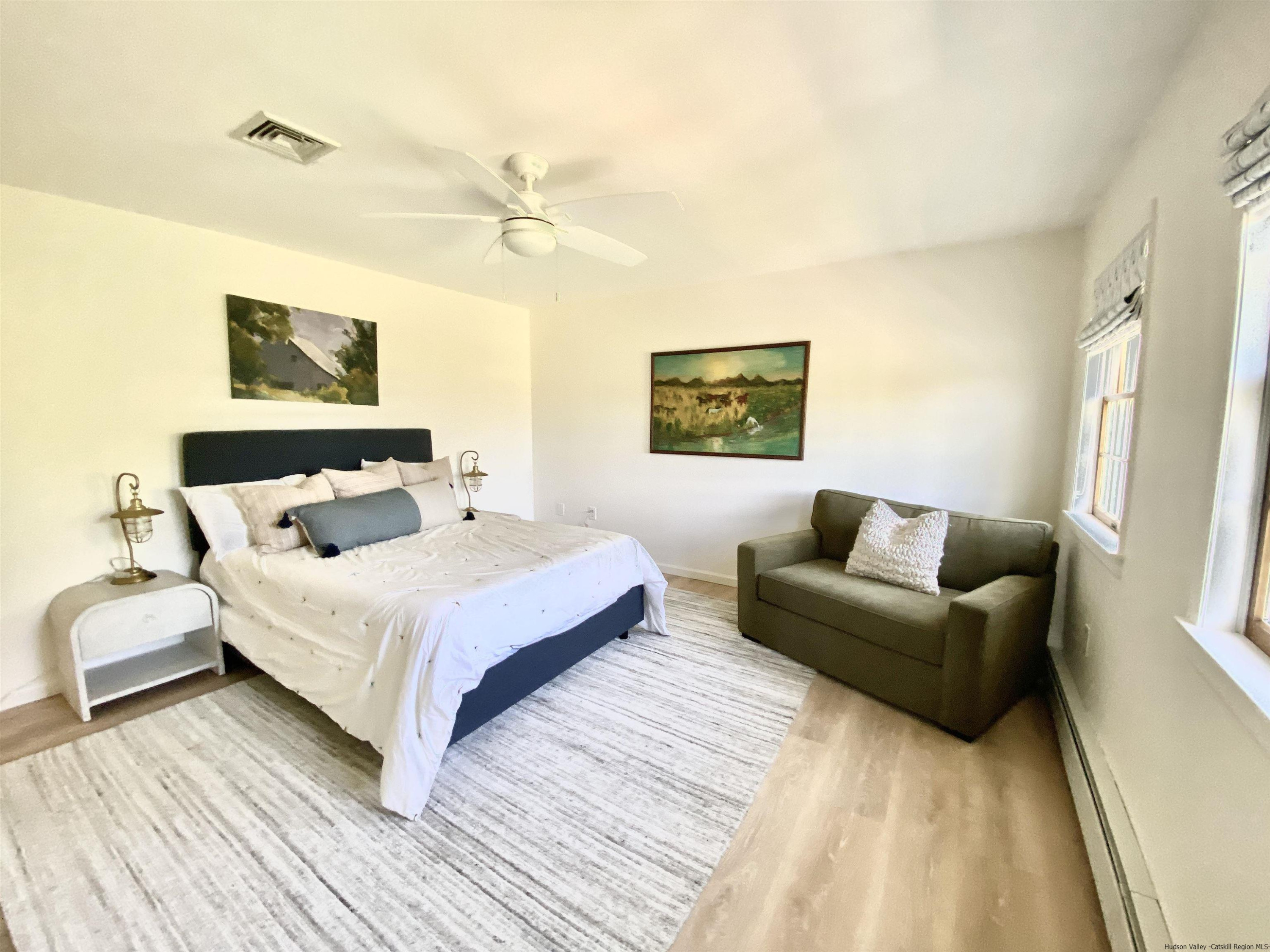 29 Millbrook Road Gardiner, NY 12589 - Photo 16 of 34 a spacious bedroom with a bed and a couch