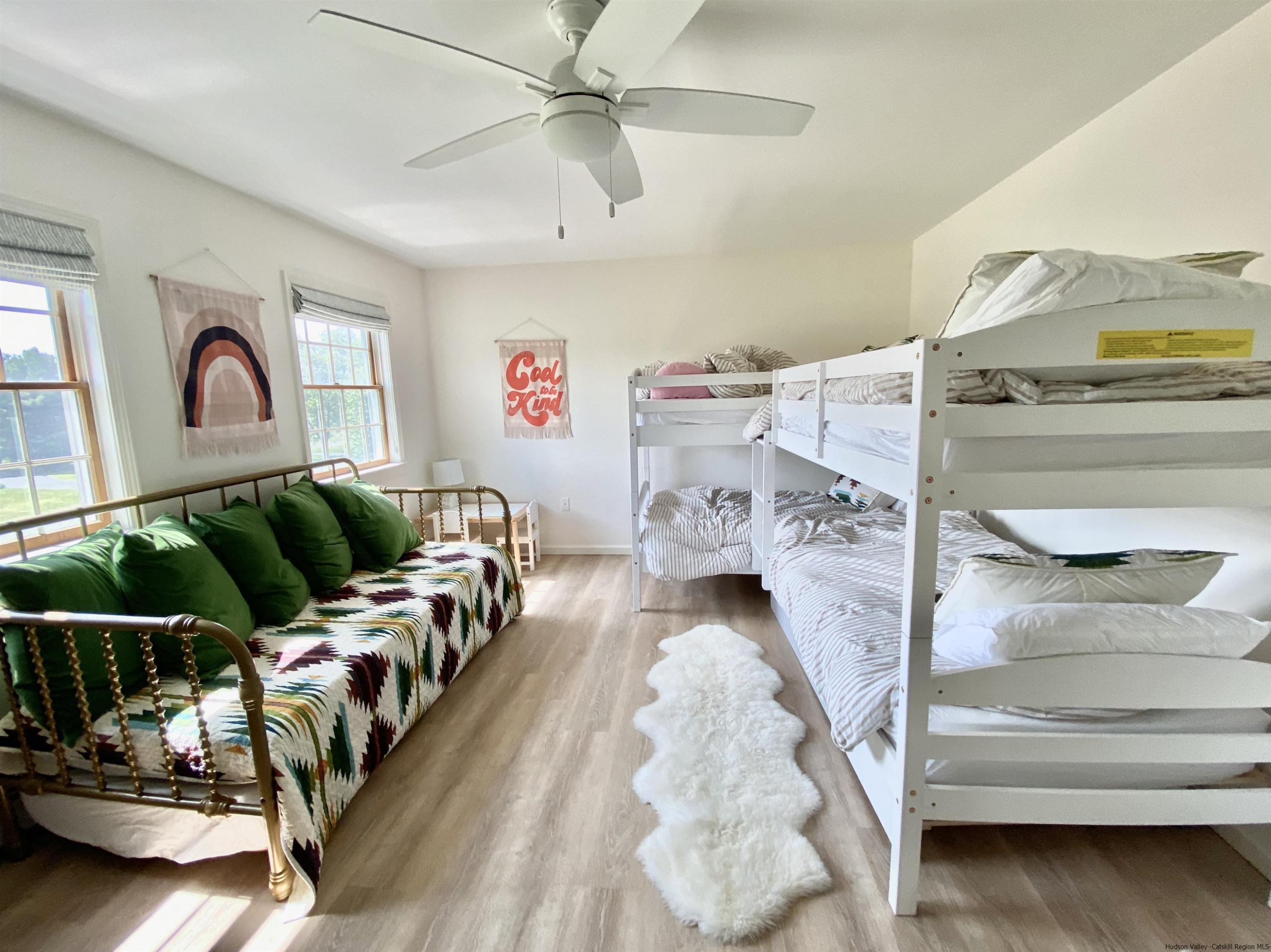 29 Millbrook Road Gardiner, NY 12589 - Photo 18 of 34 a living room with furniture and a chandelier