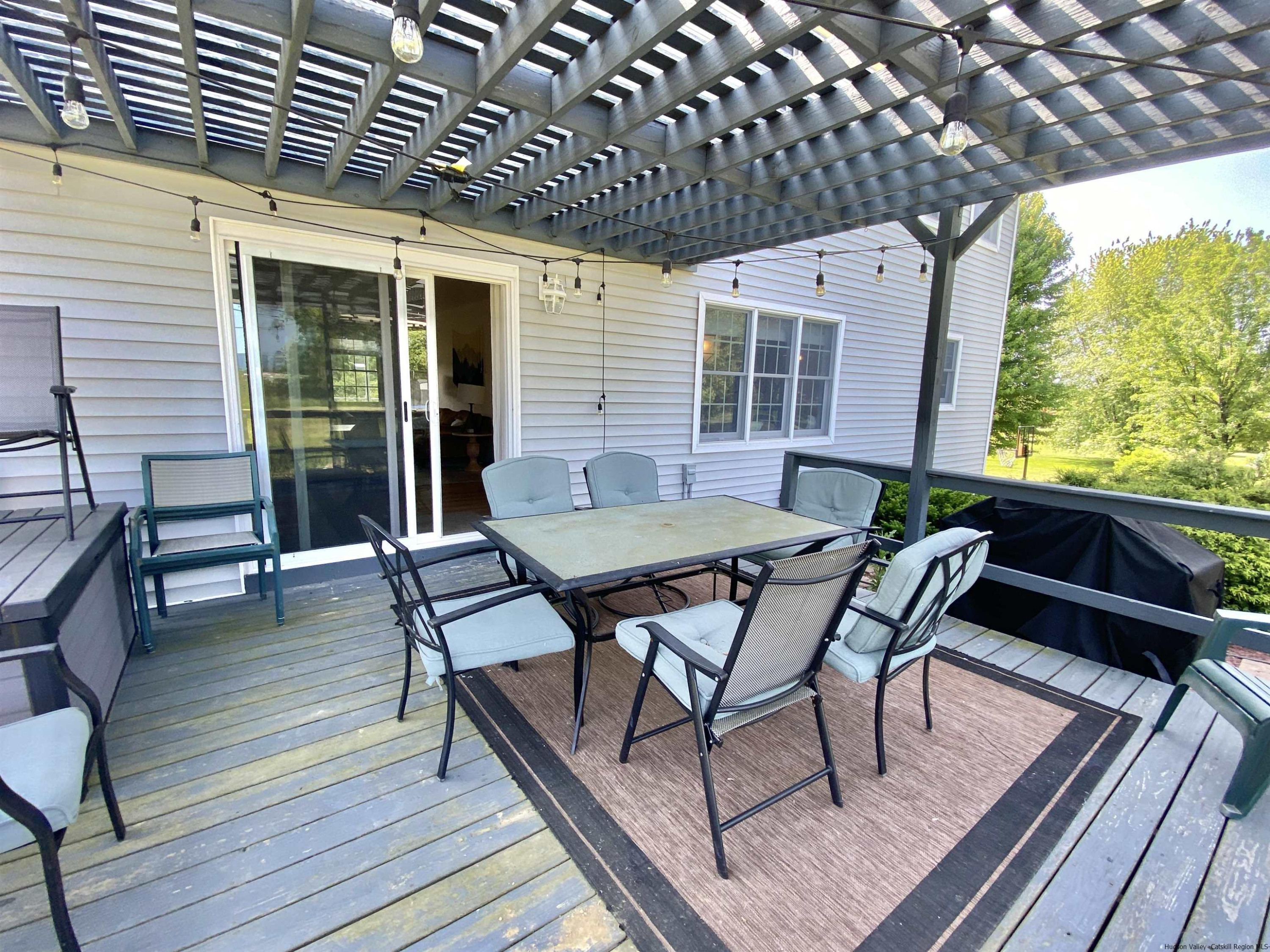 29 Millbrook Road Gardiner, NY 12589 - Photo 20 of 34 a patio with glass top table and chairs