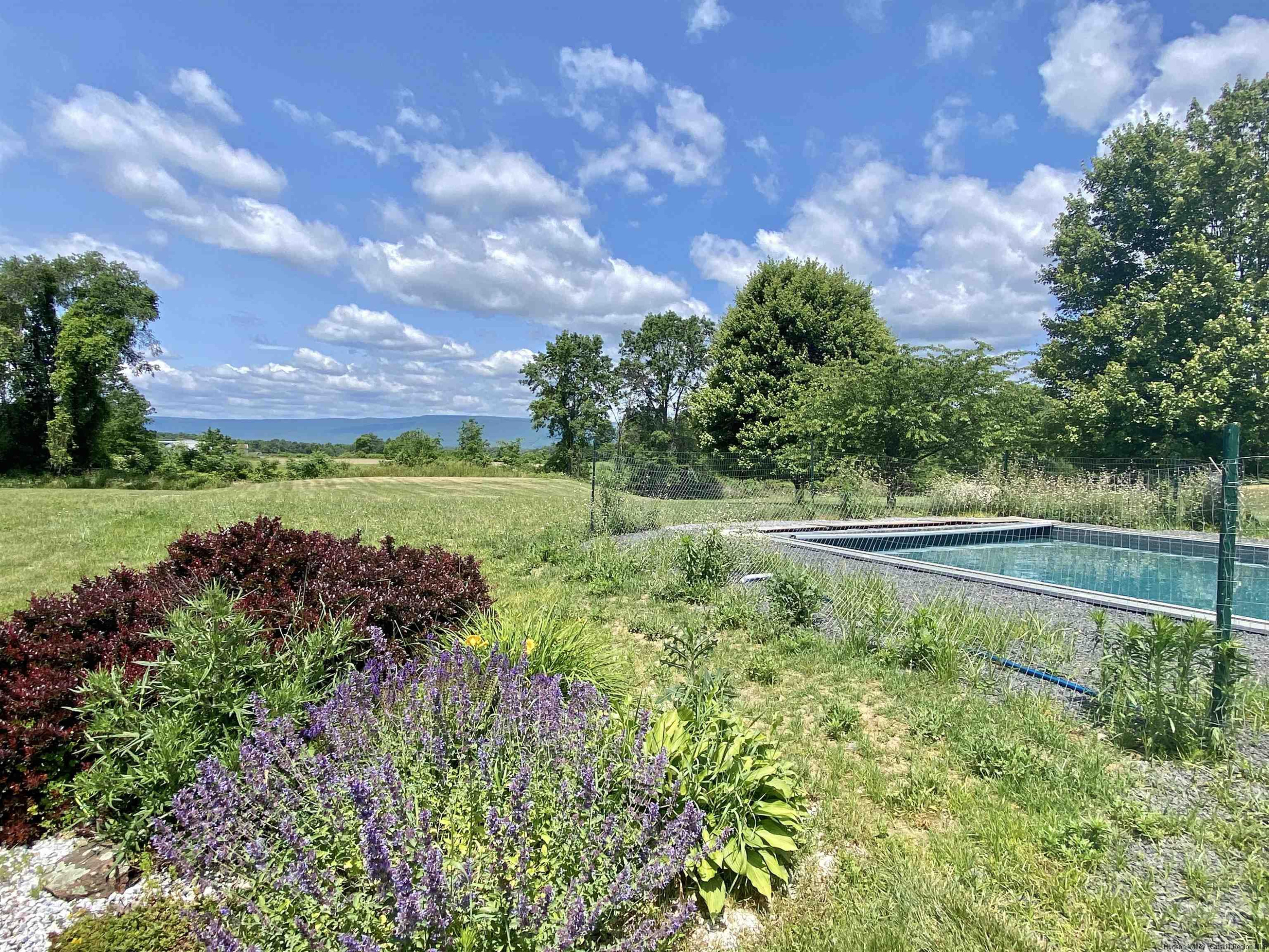 29 Millbrook Road Gardiner, NY 12589 - Photo 23 of 34 a view of a lake with a house in the background