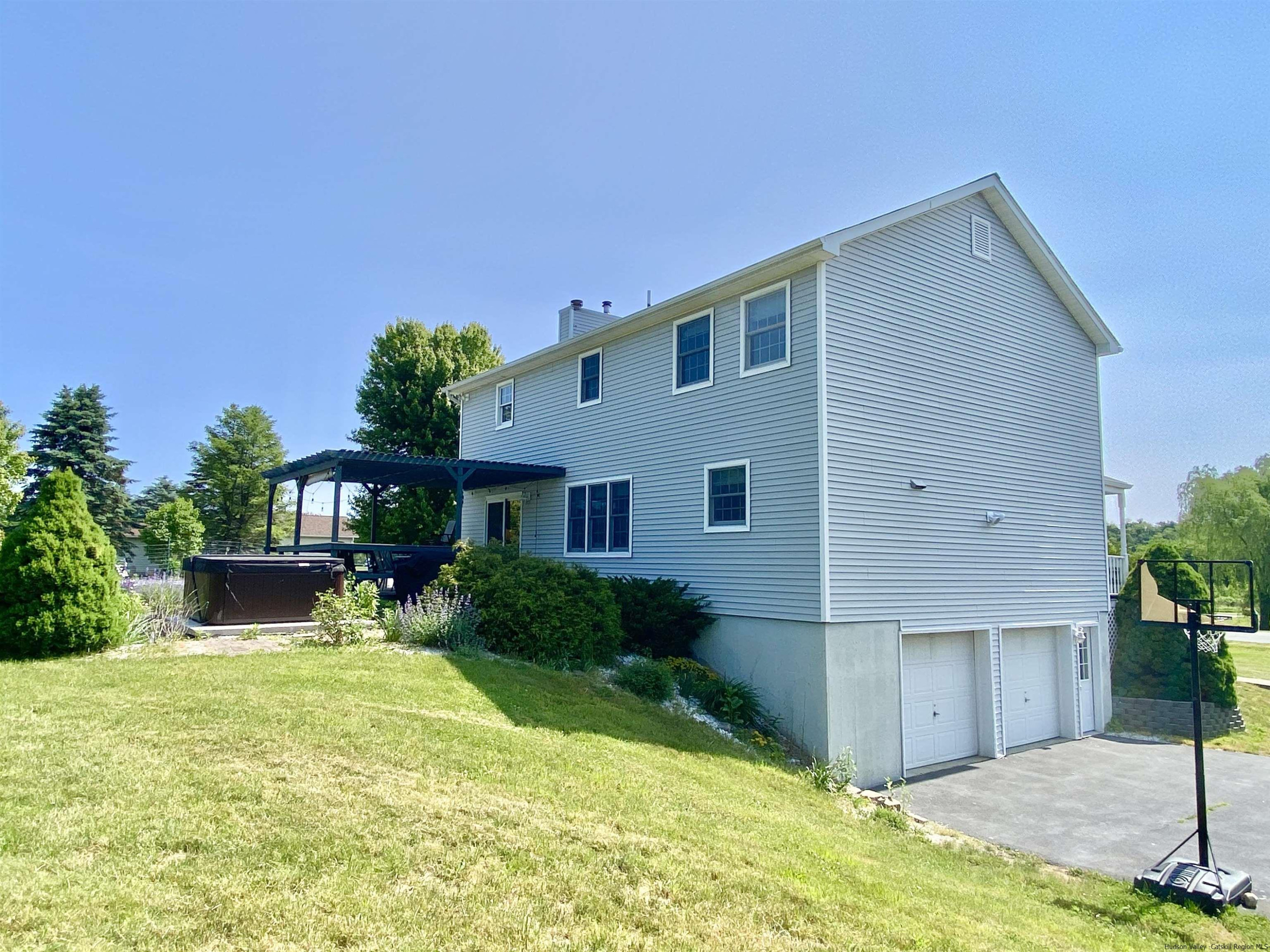 29 Millbrook Road Gardiner, NY 12589 - Photo 26 of 34 a front view of a house with a yard and garage