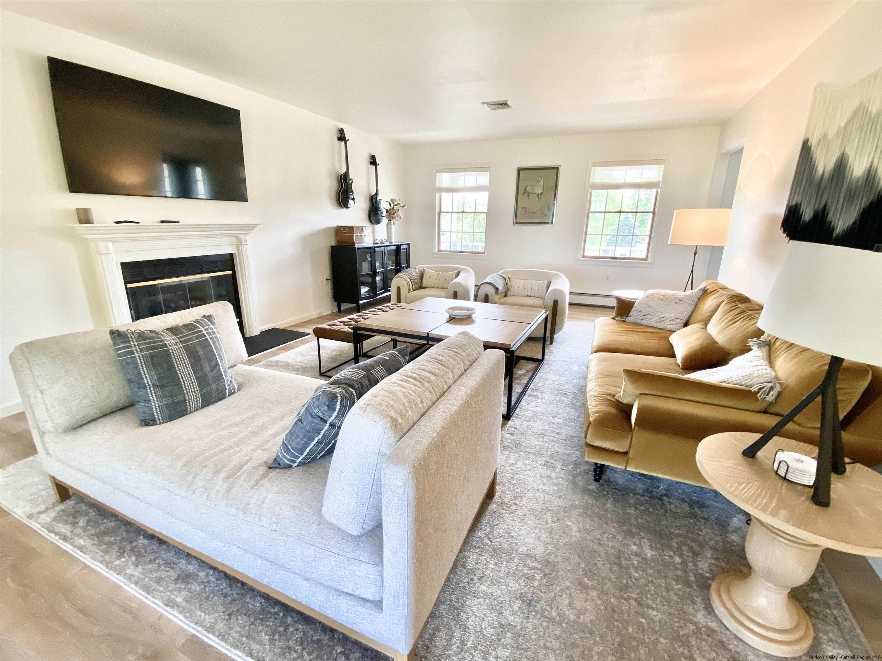 29 Millbrook Road Gardiner, NY 12589 - Photo 5 of 34 a living room with fireplace furniture and a flat screen tv