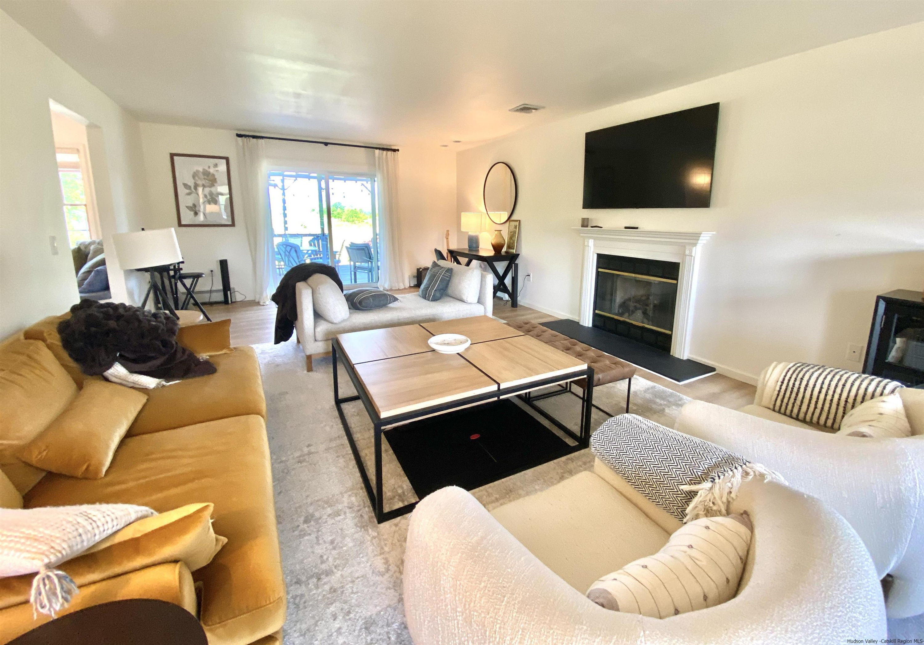 29 Millbrook Road Gardiner, NY 12589 - Photo 8 of 34 a living room with furniture and a flat screen tv