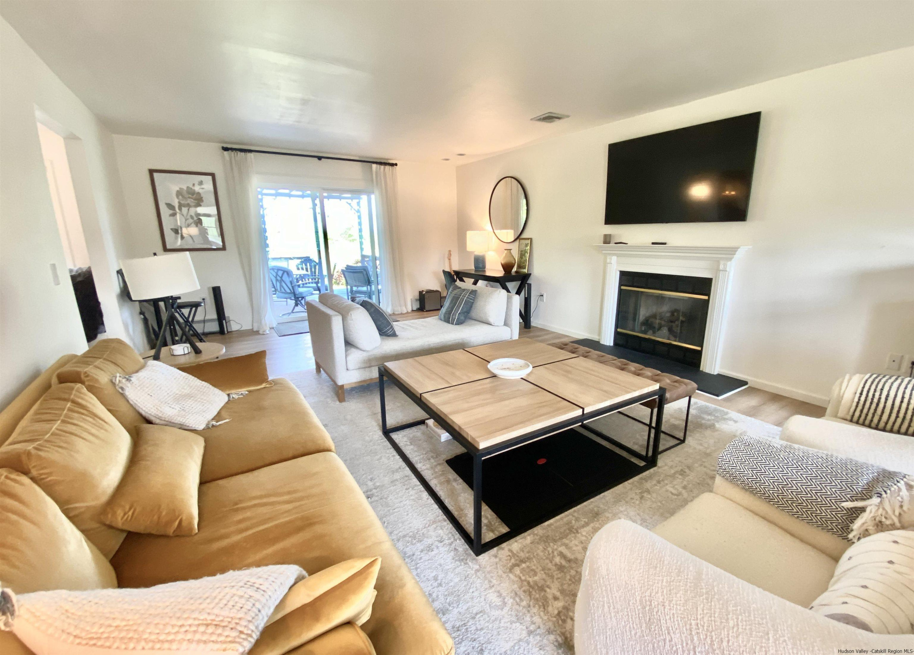 29 Millbrook Road Gardiner, NY 12589 - Photo 9 of 34 a living room with furniture and a flat screen tv