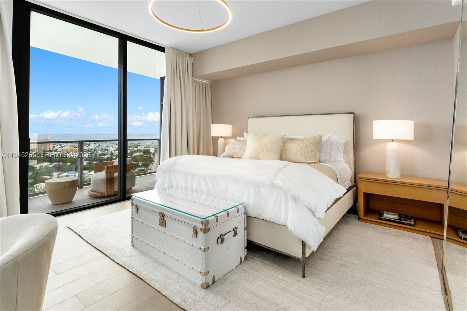 500 Alton Road, Unit 2105 Miami Beach, FL 33139 - Photo 14 of 44 a spacious bedroom with a bed and large window