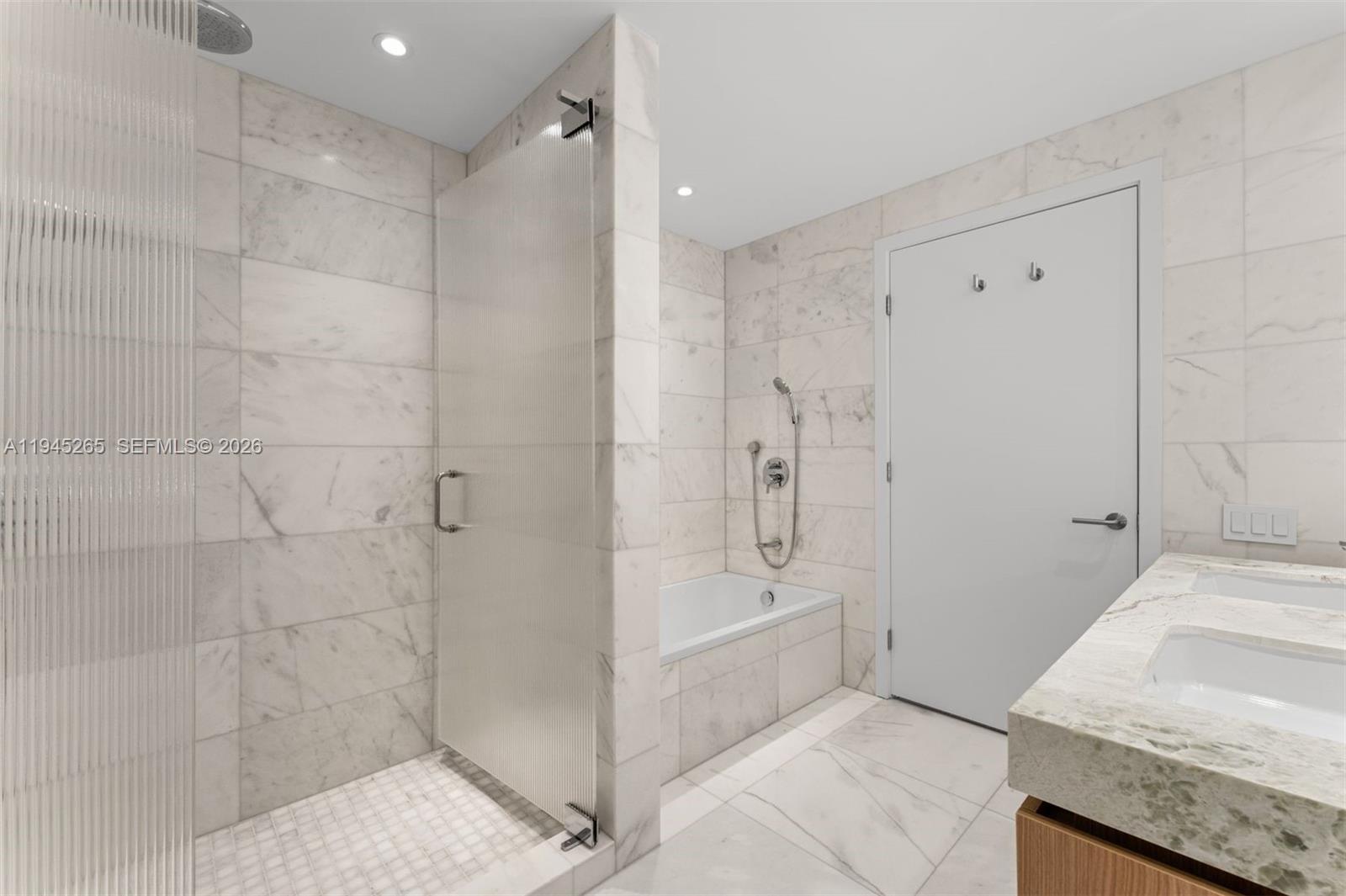 500 Alton Road, Unit 2105 Miami Beach, FL 33139 - Photo 17 of 44 a bathroom with a granite countertop sink a toilet and shower