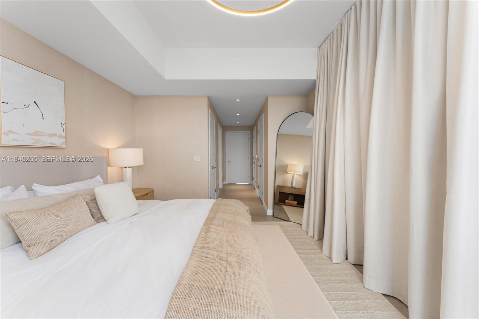 500 Alton Road, Unit 2105 Miami Beach, FL 33139 - Photo 21 of 44 a bedroom with a bed and a lamp