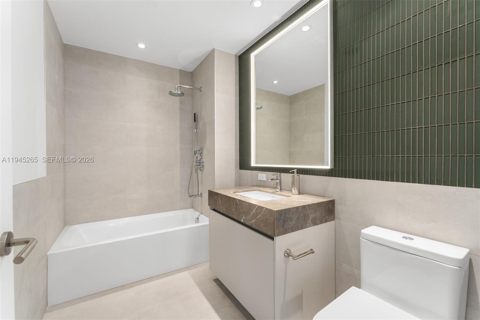 500 Alton Road, Unit 2105 Miami Beach, FL 33139 - Photo 22 of 44 a bathroom with a sink a toilet and shower