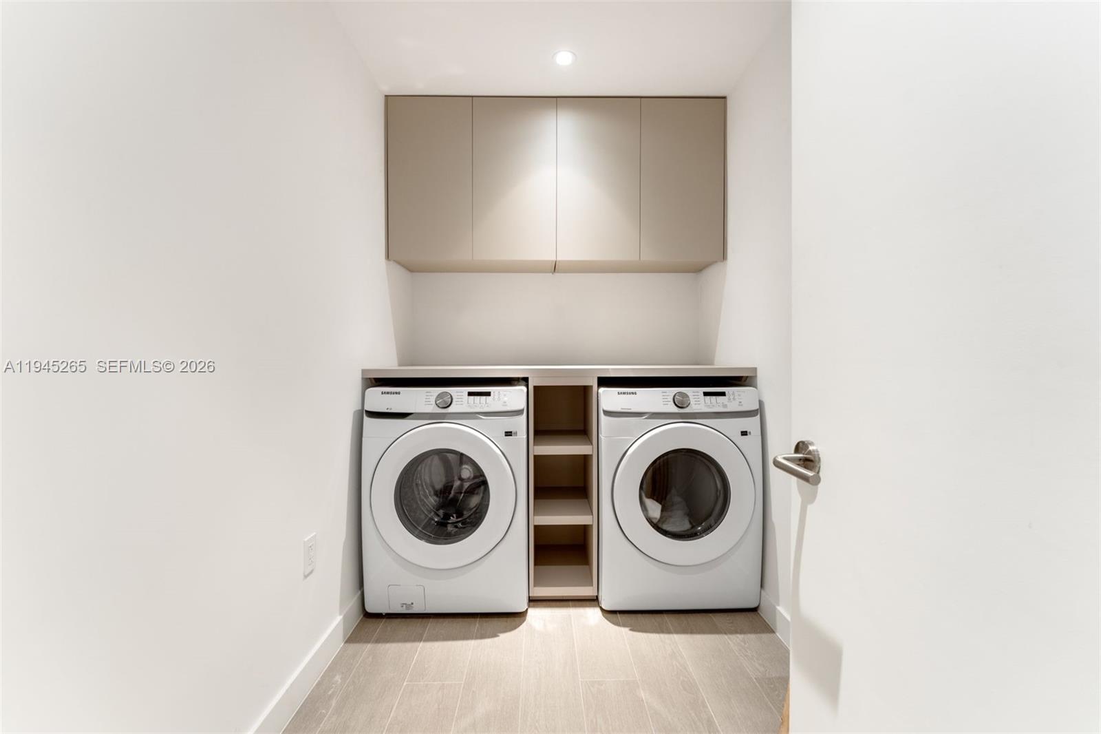 500 Alton Road, Unit 2105 Miami Beach, FL 33139 - Photo 27 of 44 a utility room with dryer and washer