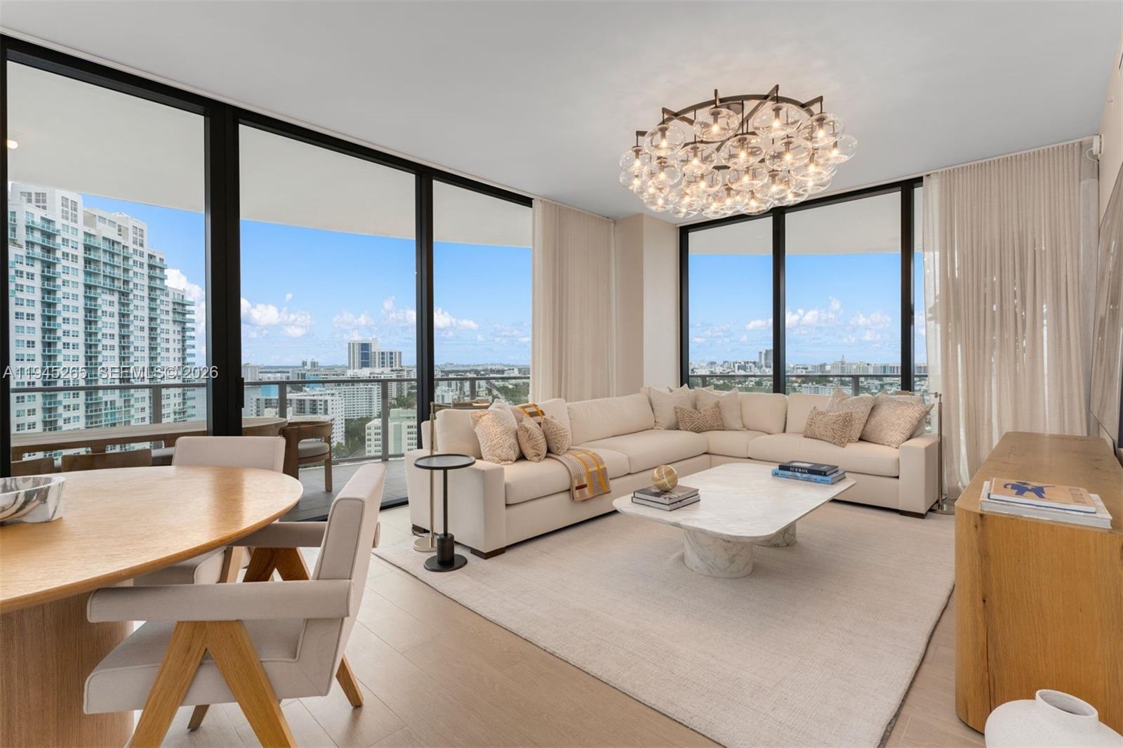 500 Alton Road, Unit 2105 Miami Beach, FL 33139 - Photo 3 of 44 a living room with furniture and a large window