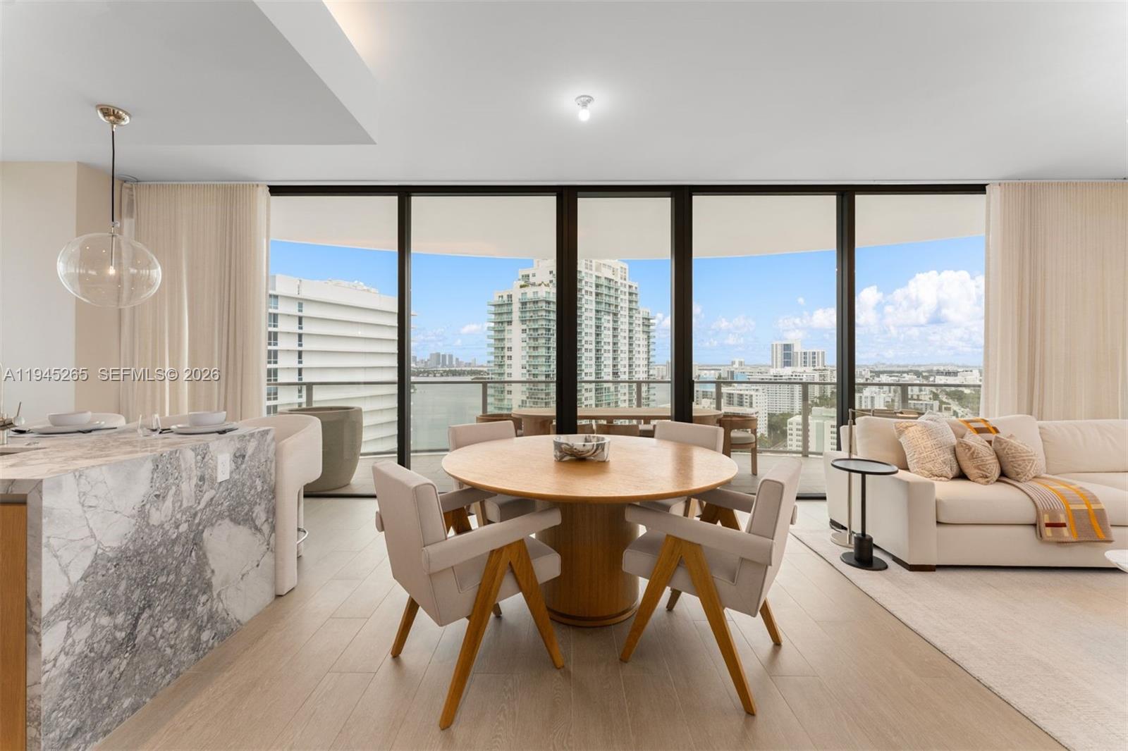 500 Alton Road, Unit 2105 Miami Beach, FL 33139 - Photo 4 of 44 a living room with furniture and a large window