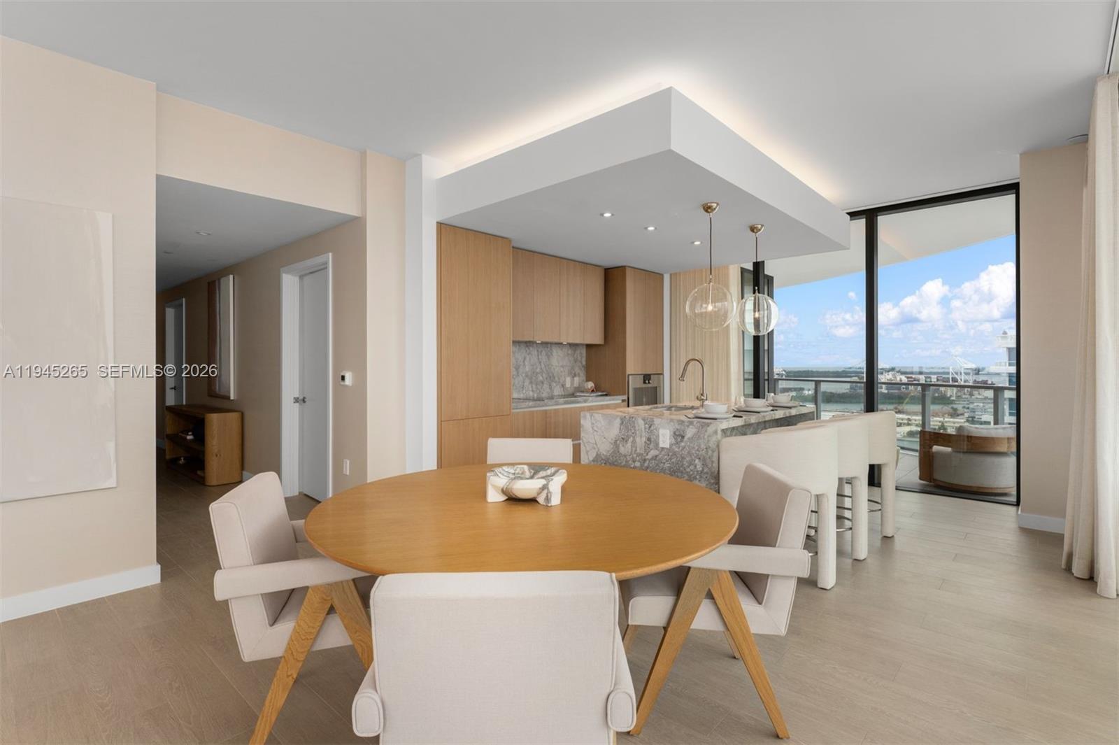 500 Alton Road, Unit 2105 Miami Beach, FL 33139 - Photo 5 of 44 a dining room with furniture a window and kitchen view