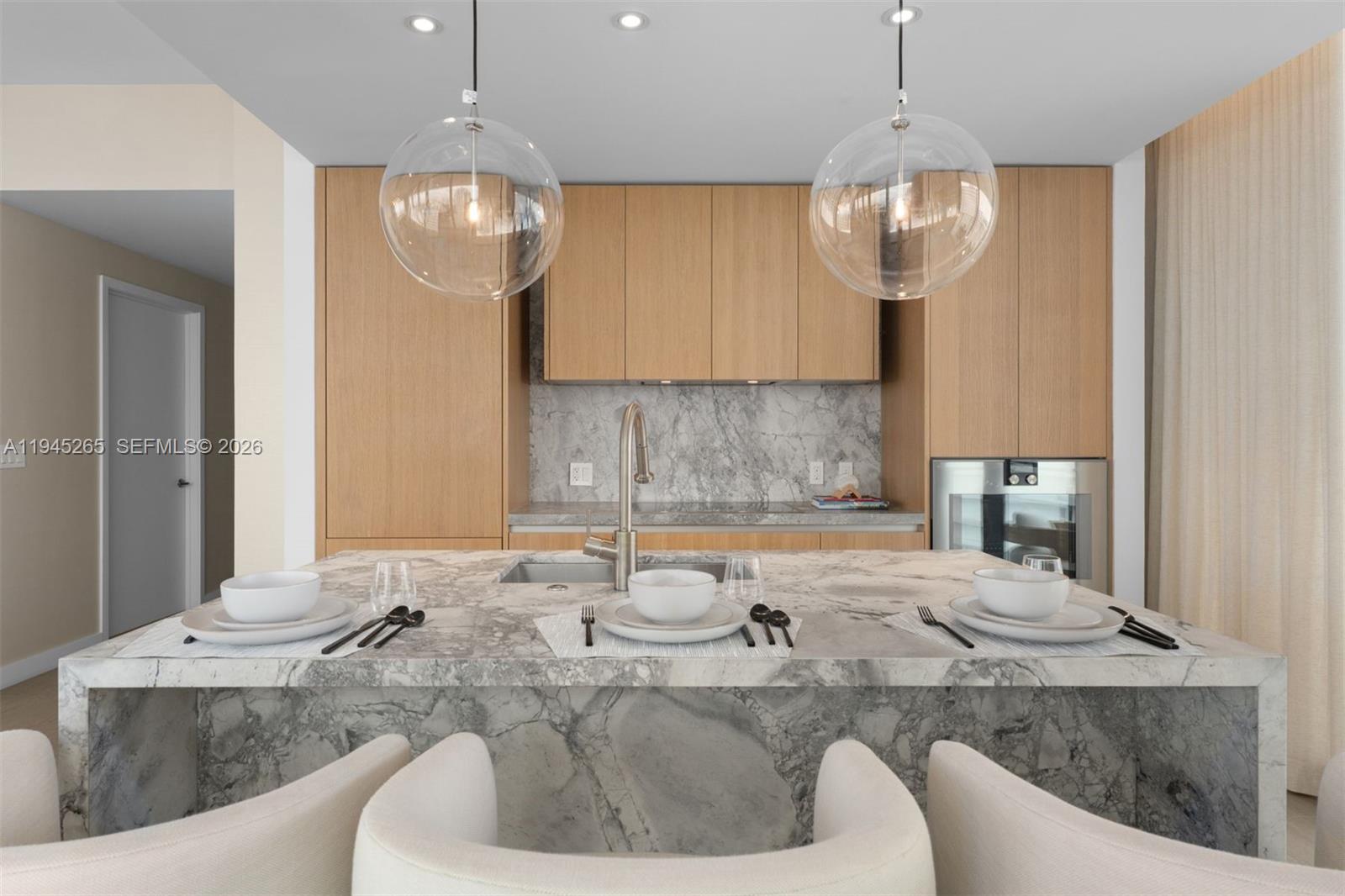 500 Alton Road, Unit 2105 Miami Beach, FL 33139 - Photo 7 of 44 a kitchen with granite countertop a sink a stove and cabinets