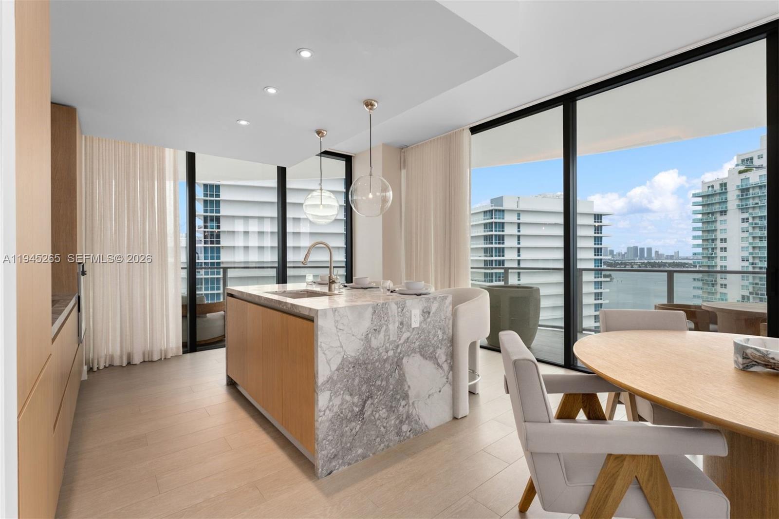 500 Alton Road, Unit 2105 Miami Beach, FL 33139 - Photo 8 of 44 a living room with furniture and large windows