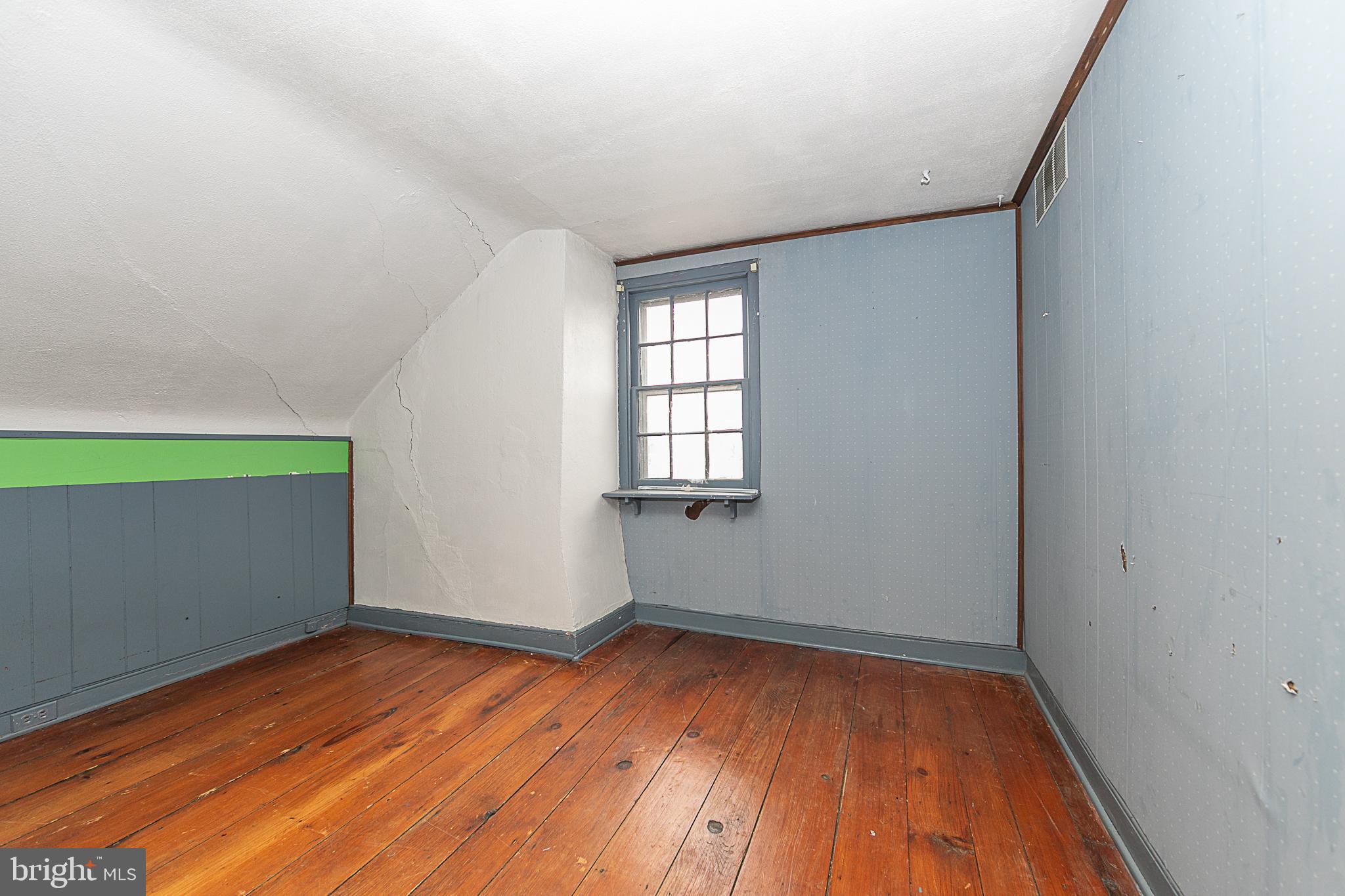 59 Market Street Salem, NJ 08079 - Photo 14 of 21 an empty room with wooden floor and windows