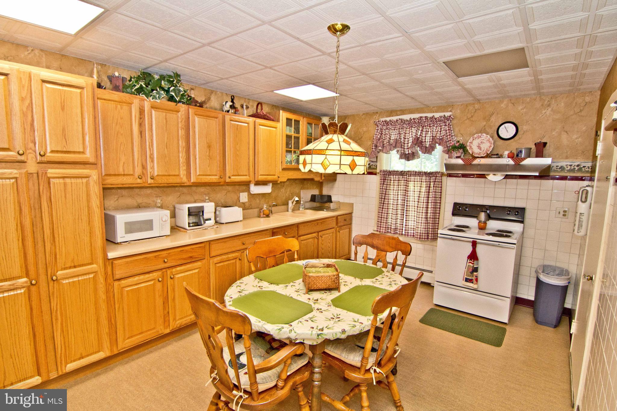 59 Market Street Salem, NJ 08079 - Photo 15 of 21 a kitchen with stainless steel appliances granite countertop a sink and cabinets