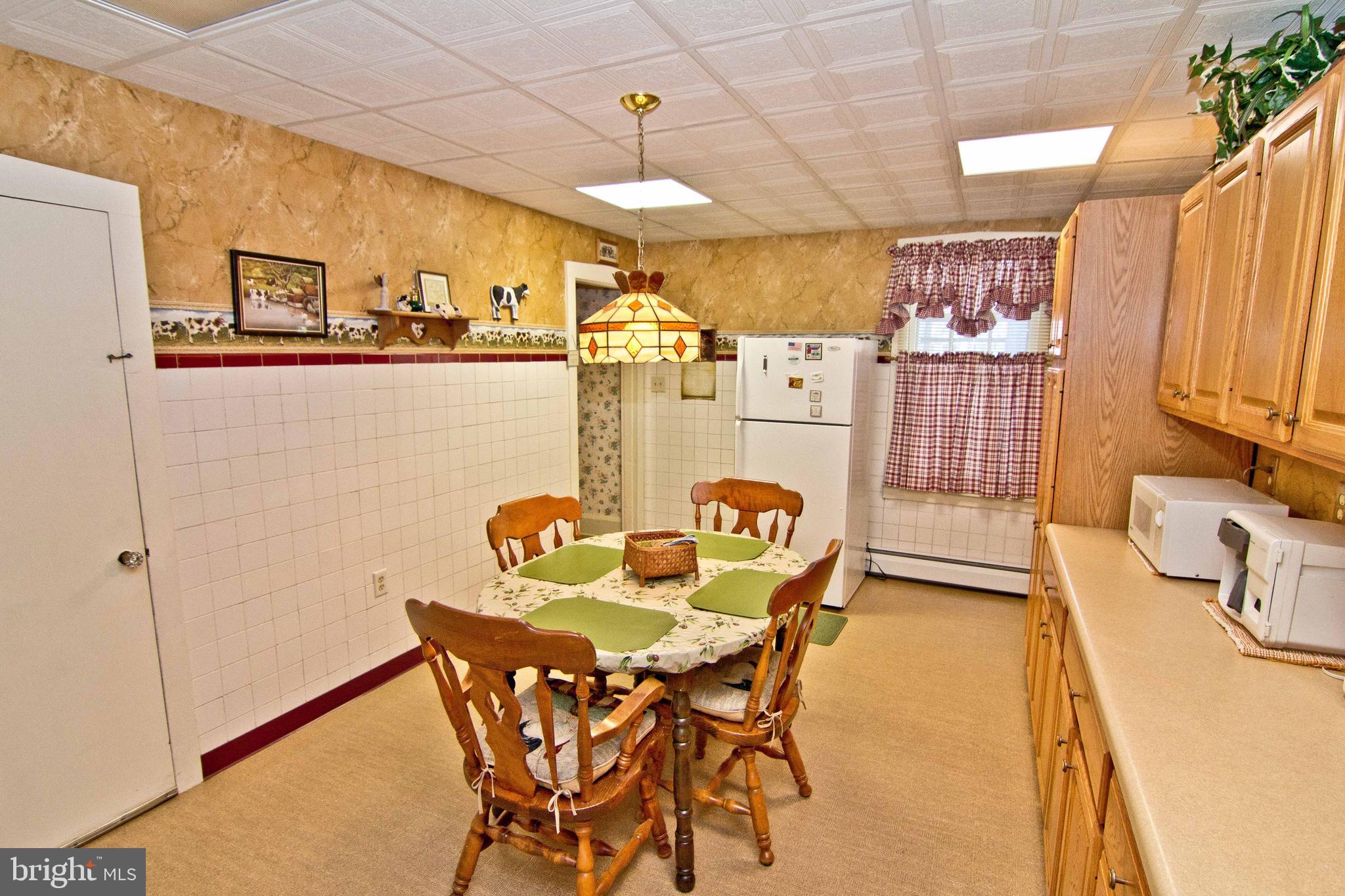 59 Market Street Salem, NJ 08079 - Photo 16 of 21 a dining room with furniture and a floor to ceiling window