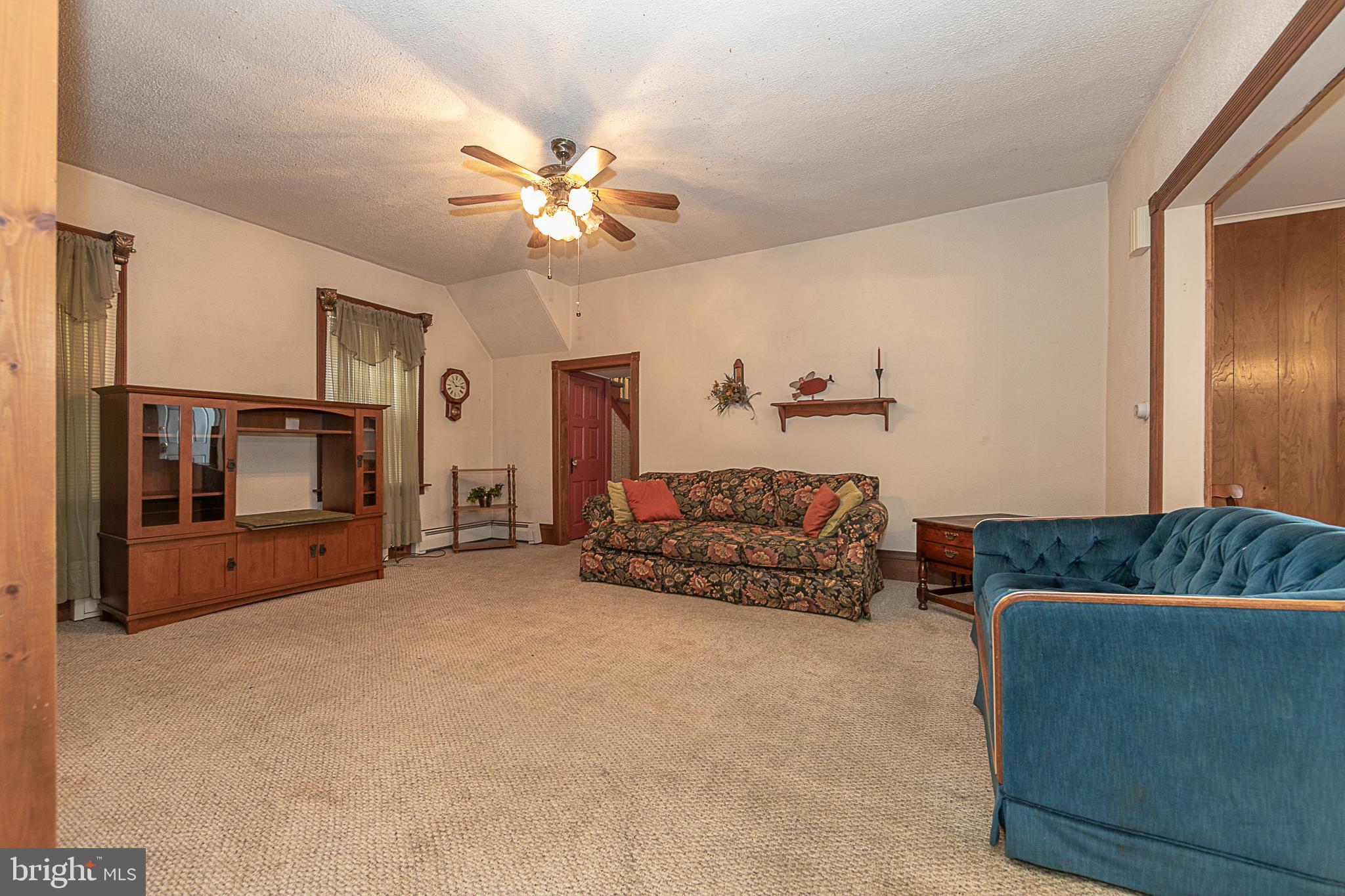 59 Market Street Salem, NJ 08079 - Photo 4 of 21 a living room with furniture and a flat screen tv