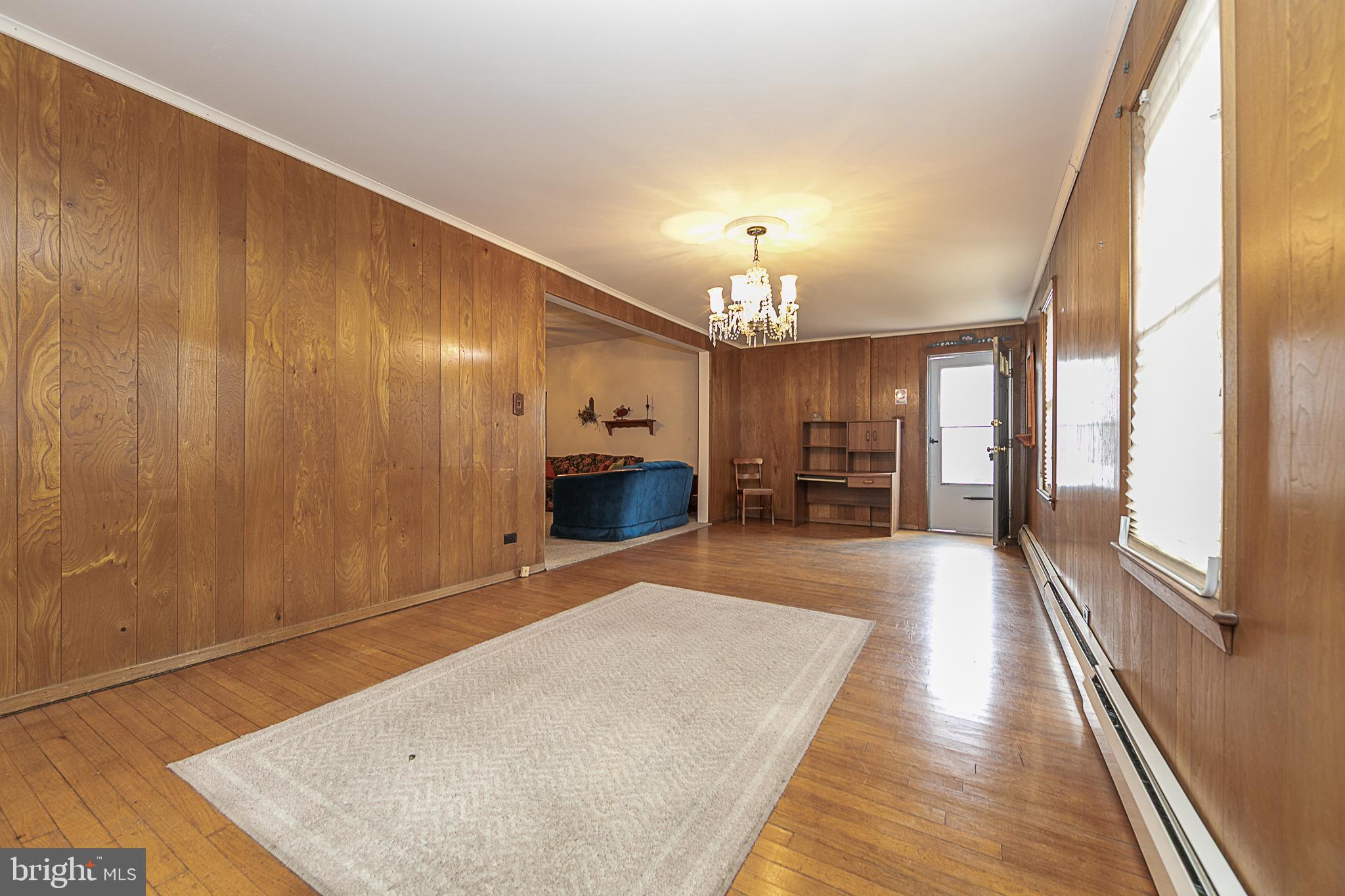 59 Market Street Salem, NJ 08079 - Photo 8 of 21 a view of a room with wooden floor and chandelier