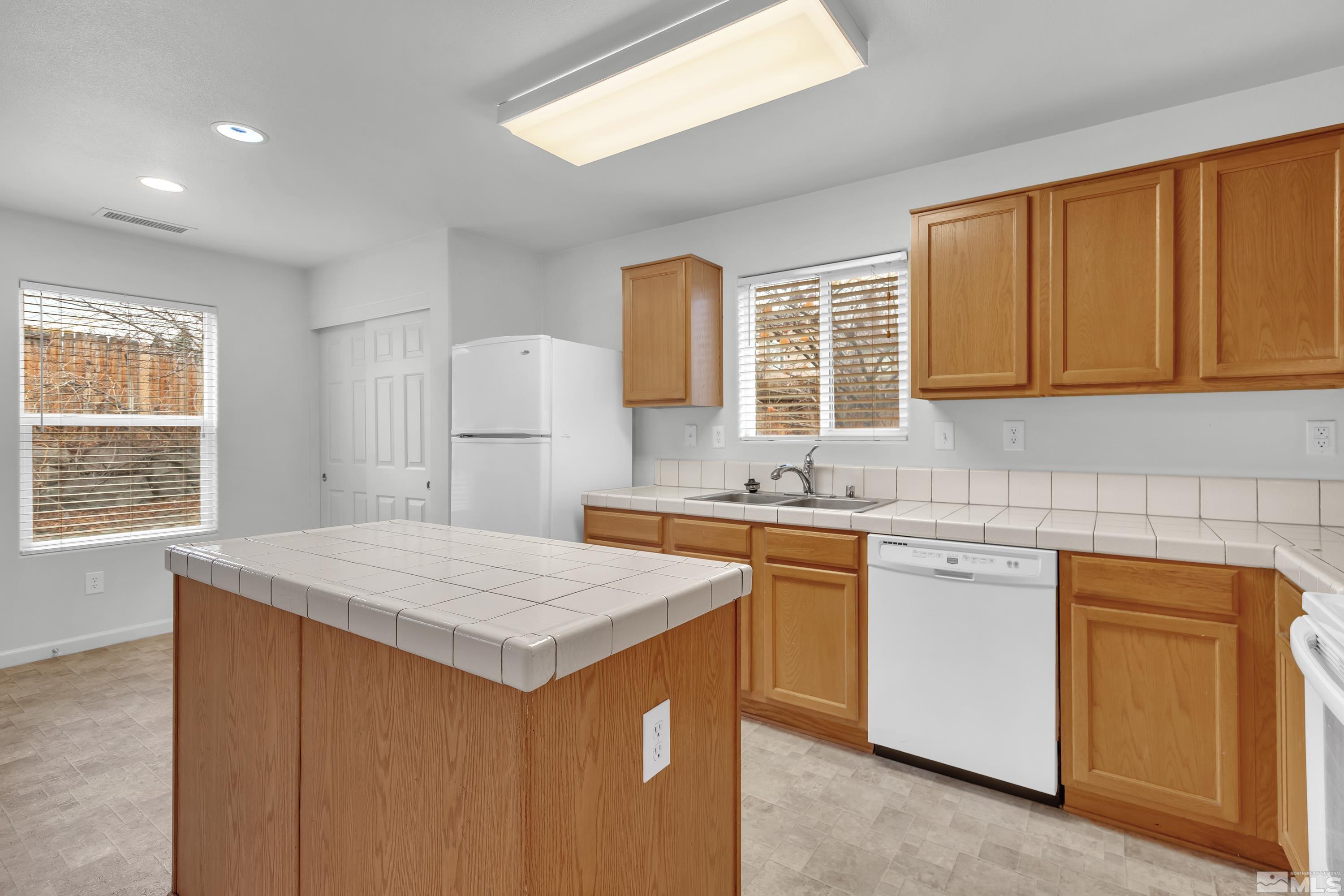 2928 Bryan Street Reno, NV 89503 - Photo 13 of 37 a kitchen that has a sink and a stove in it