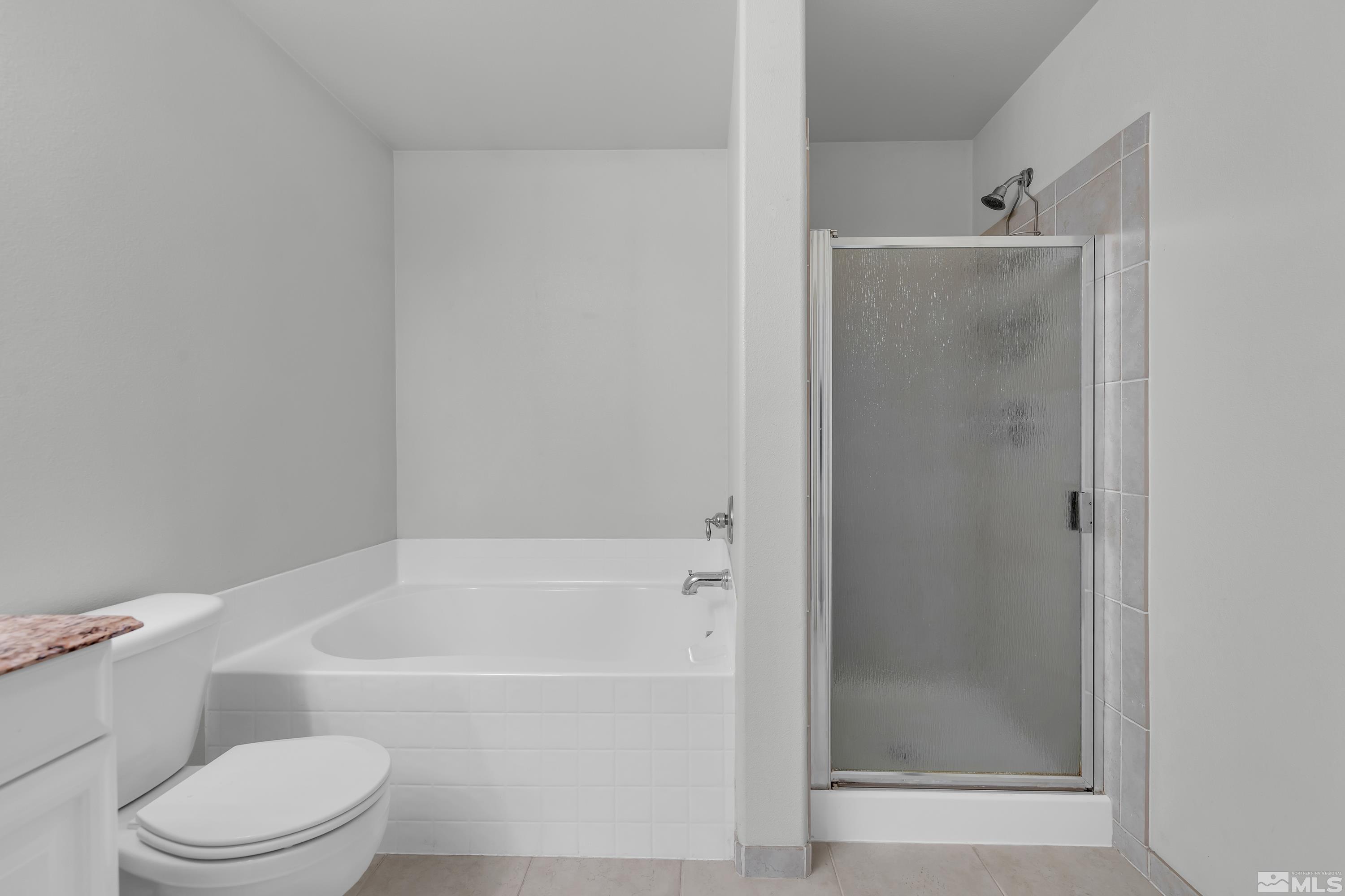 2928 Bryan Street Reno, NV 89503 - Photo 20 of 37 a bathroom with a toilet and a bathtub