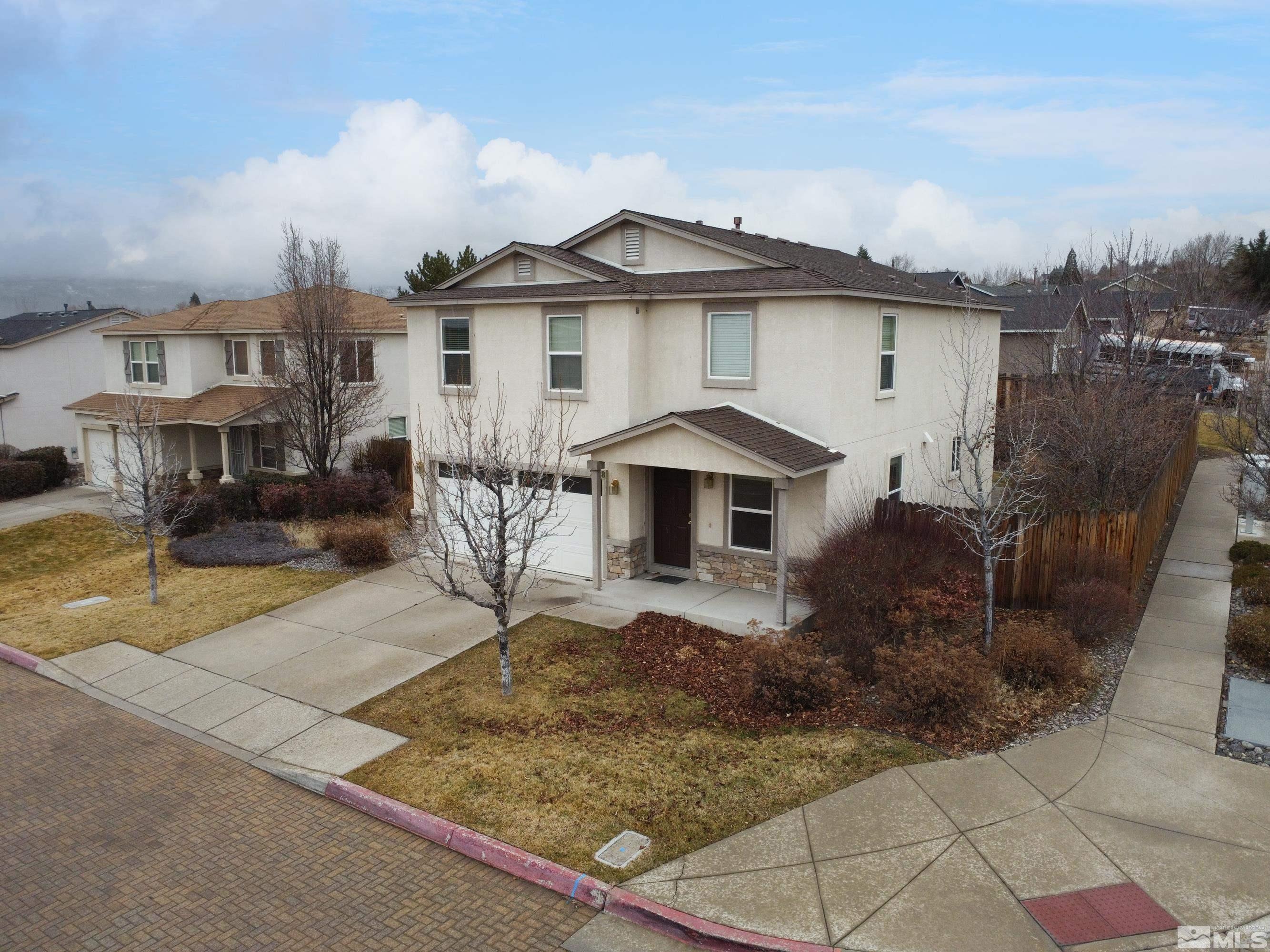 2928 Bryan Street Reno, NV 89503 - Photo 2 of 37 a front view of a house with garden
