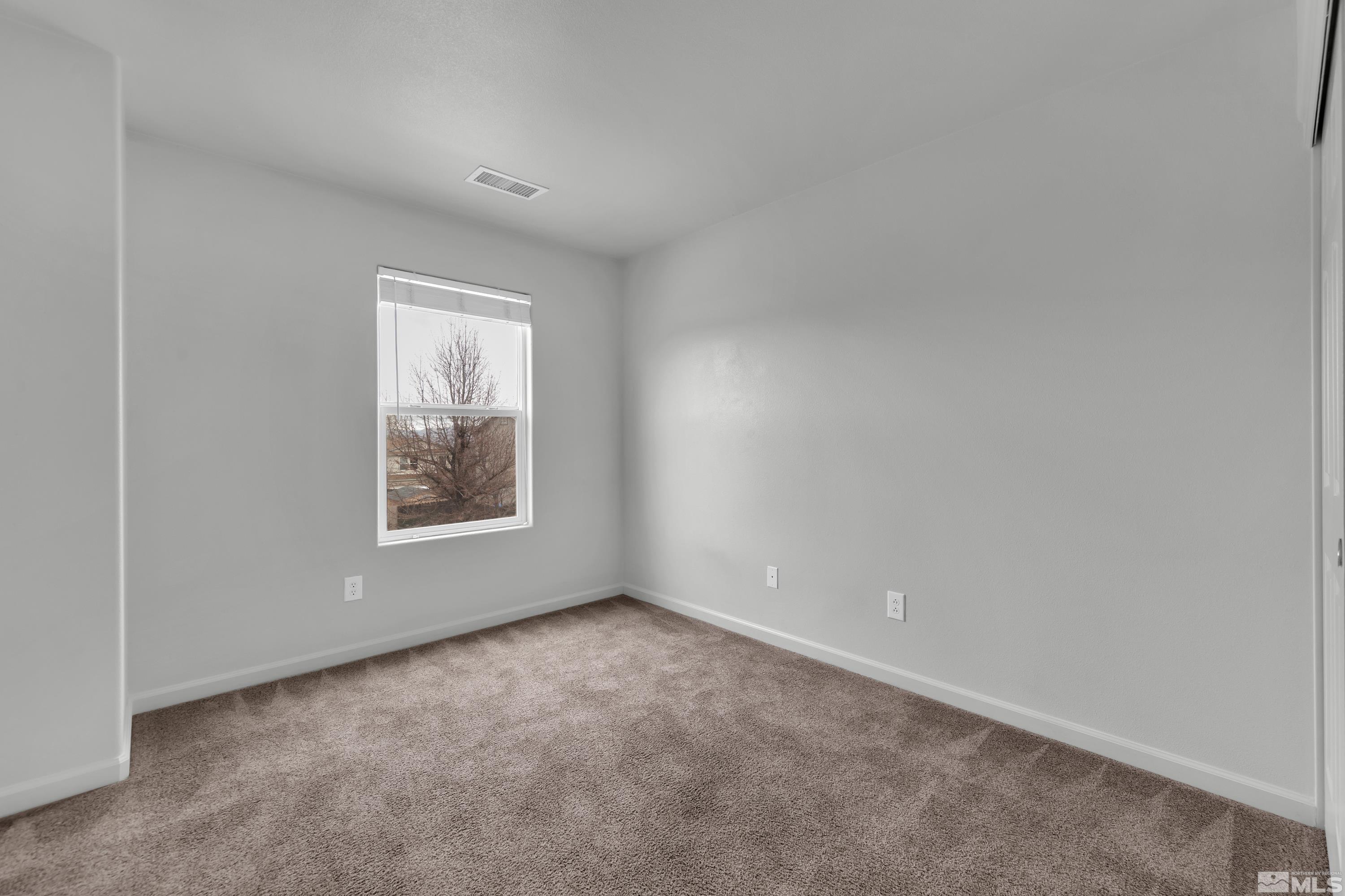 2928 Bryan Street Reno, NV 89503 - Photo 23 of 37 a view of an empty room with a window