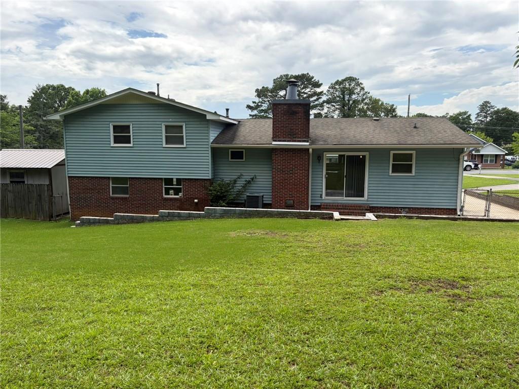 52 Lyons Drive Northwest Rome, GA 30165 - Photo 25 of 34 a front view of house with yard and green space