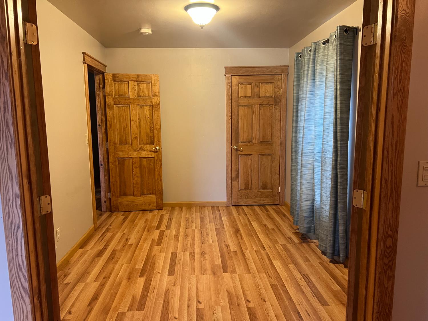 312 South Church Street Ione, CA 95640 - Photo 12 of 22 a view of a room with wooden floor and brick walls