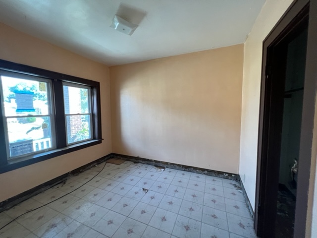 305 153rd Street Calumet City, IL 60409 - Photo 12 of 40 an empty room with windows