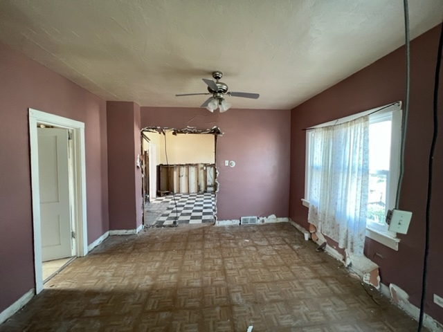 305 153rd Street Calumet City, IL 60409 - Photo 18 of 40 a view of an empty room with a fireplace and a window