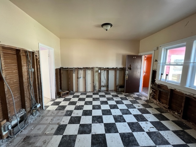 305 153rd Street Calumet City, IL 60409 - Photo 19 of 40 a black and white checkered floor with a black white checkered floor with a black white checkered floor next to a window