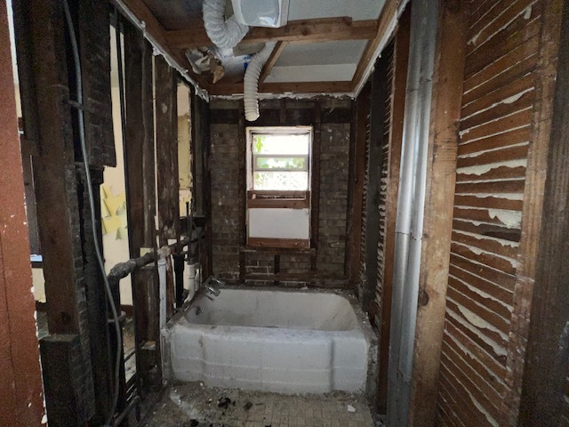 305 153rd Street Calumet City, IL 60409 - Photo 24 of 40 a bathroom with a bathtub and shower