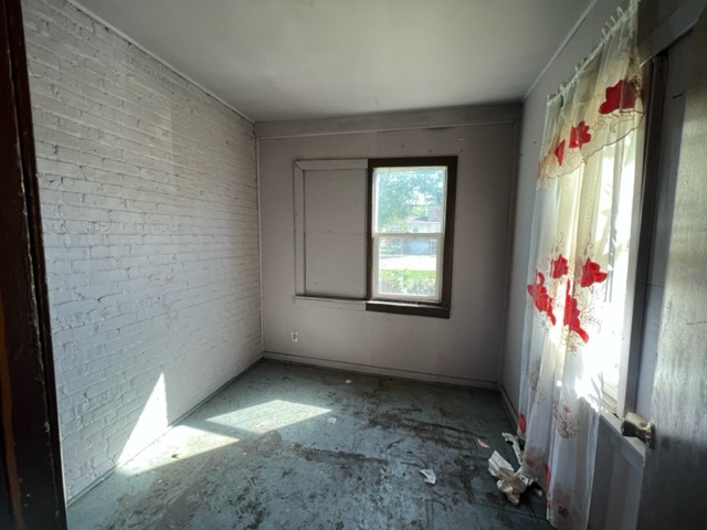 305 153rd Street Calumet City, IL 60409 - Photo 6 of 40 a view of an empty room with a window