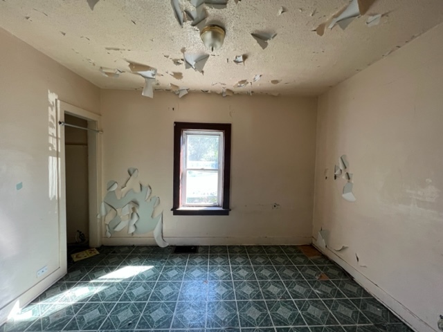 305 153rd Street Calumet City, IL 60409 - Photo 7 of 40 a view of an empty room with a window